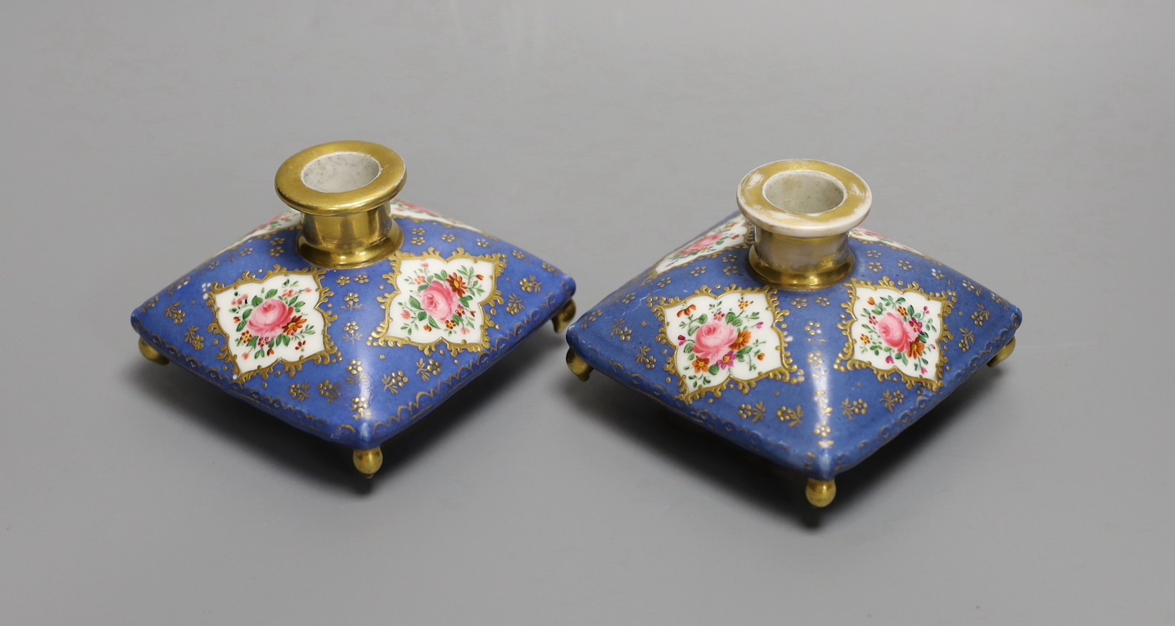 A pair of mid 19th century Paris porcelain 'cushion' shaped scent bottles decorated in Sevres style with pink roses (lacking stoppers)